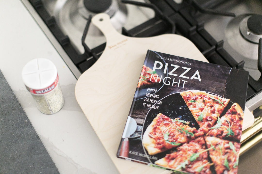 Pizza night in a box - Mario gift box by Mercy Forest Co. with Williams Sonoma Pizza Night cookbook and Delallo seasonings / pizza flour / pizza sauce. Comes with wood pizza peel and black lava stone.