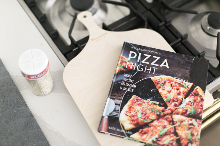 Pizza night in a box - Mario gift box by Mercy Forest Co. with Williams Sonoma Pizza Night cookbook and Delallo seasonings / pizza flour / pizza sauce. Comes with wood pizza peel and black lava stone.