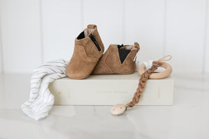 Spoil tiny toes with stylish Little Love Bug Co. leather shoes. Choose from white, pink suede, or chelsea boot (color)