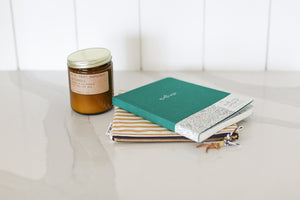 custom curated gift boxes with candle, canvas bags, and self care journals