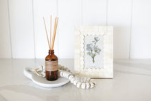 Load image into Gallery viewer, Spoil someone special with this beautifully curated boutique gift box, ready to ship and sure to impress! Featuring a luxurious P.F. Candle Co. diffuser for aromatherapy bliss, a chic marble dish for trinkets or serving, a charming bead garland for a touch of whimsy, and a unique bone scalloped photo frame to cherish memories. Perfect for client appreciation, vendor gifts, employee recognition, administrative staff presents, or housewarming celebrations.