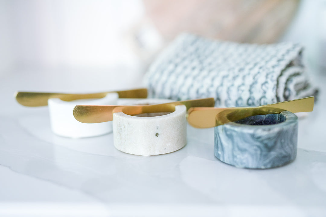 Mercy Forest Co. gift box with cotton woven kitchen towel and set of three marble condiment bowls and brass spreading knives. Ready to ship and found in our Grace gift box.