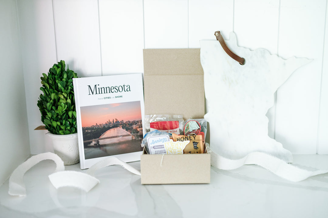 Elegant Marble Minnesota Board with a leather tie, perfect for real estate advisors to present as a thoughtful home anniversary or closing gift. This stylish board showcases Minnesota's charm and makes for a memorable keepsake.