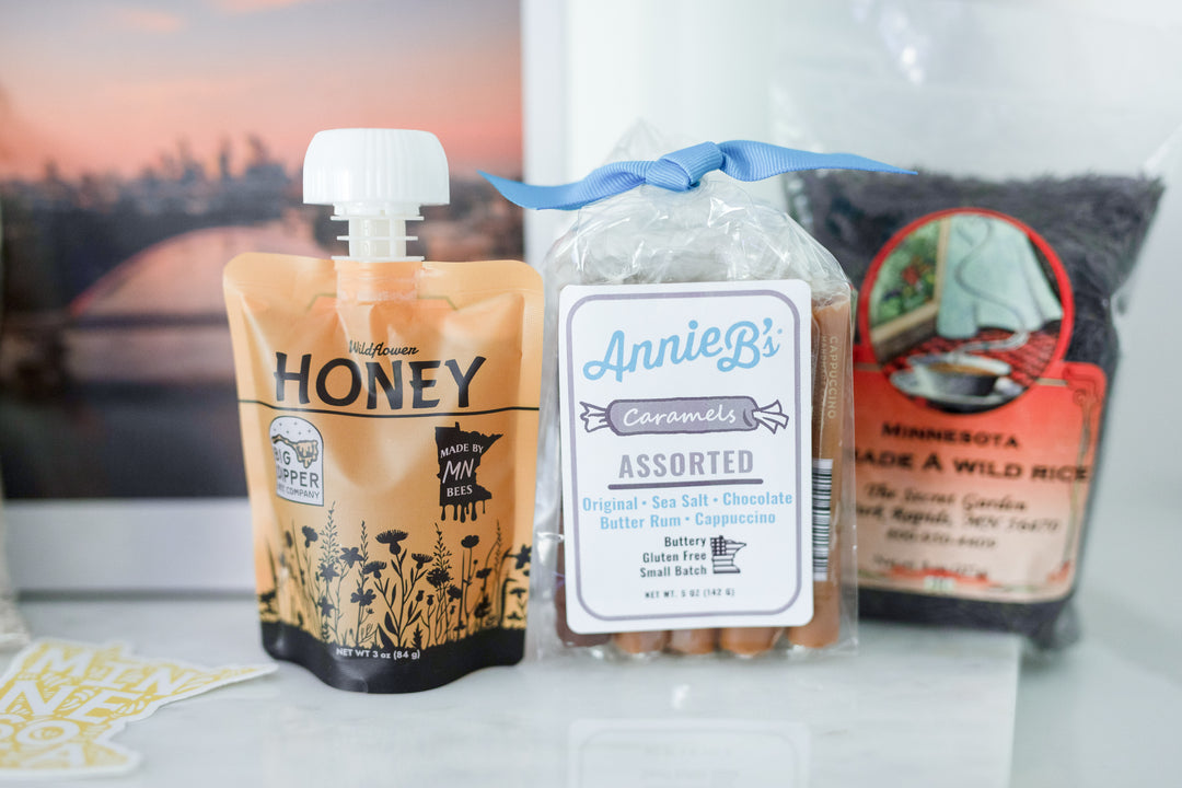 Big Dipper Bees 3.7oz honey pouch showcased in a gift box, a delightful addition for real estate advisors looking to impress clients with a taste of Minnesota. This honey pouch is perfect for closing gifts or celebrating home anniversaries.