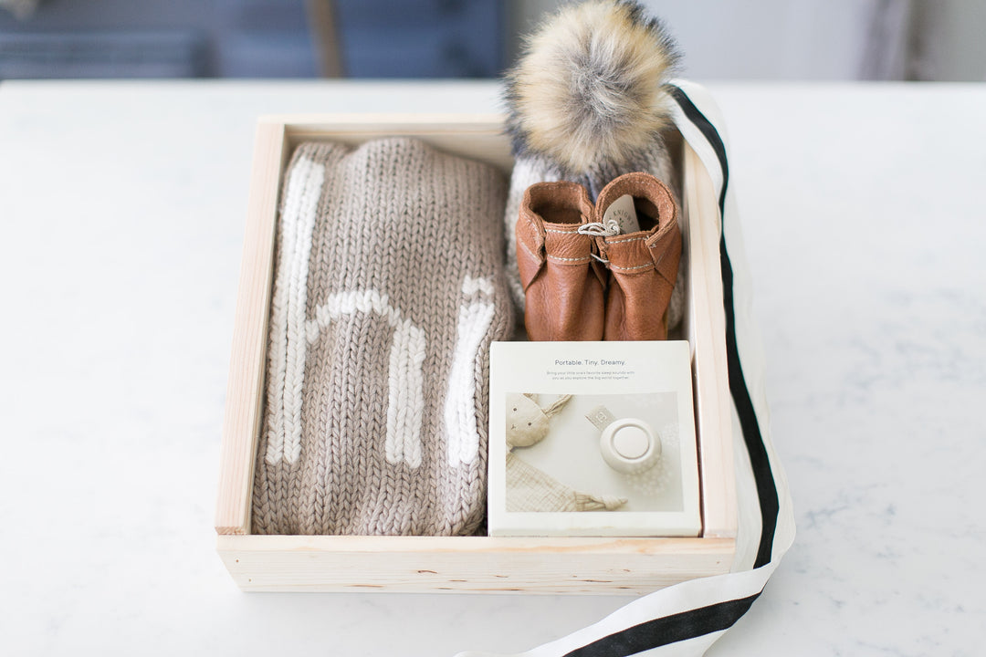 Mercy Forest Co. creates a newborn gift set featuring a cozy knit blanket and a stylish plaid hat. All ready to ship in a beautiful pine keepsake box. 