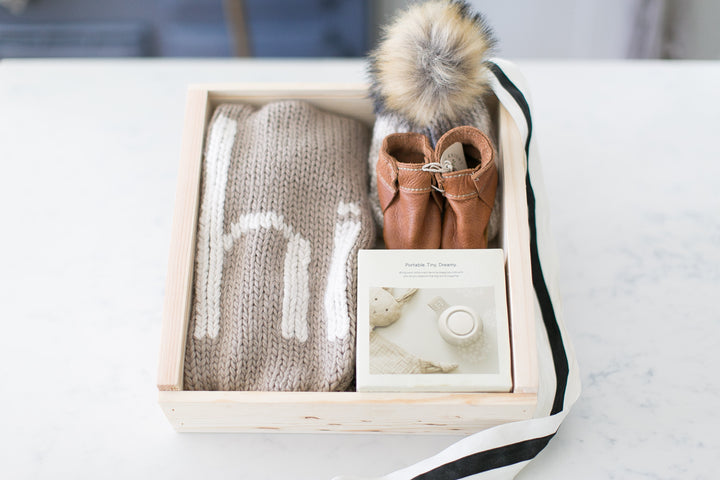 Mercy Forest Co. creates a newborn gift set featuring a cozy knit blanket and a stylish plaid hat. All ready to ship in a beautiful pine keepsake box. 