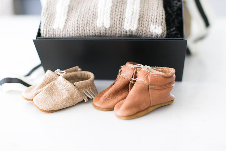 Newborn leather moccasins by Starry Knight. Found in the Signe gift box that is ready to ship from Mercy Forest Co. Brown leather moccasins 