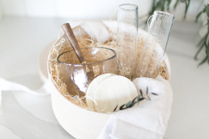 Home Anniversary or closing gift box, that is ready to ship with Mercy Forest Co. contains champagne flutes, hammered glass ice bucket, inlayed bone coasters, brass ice scoop, and linen tea towel.