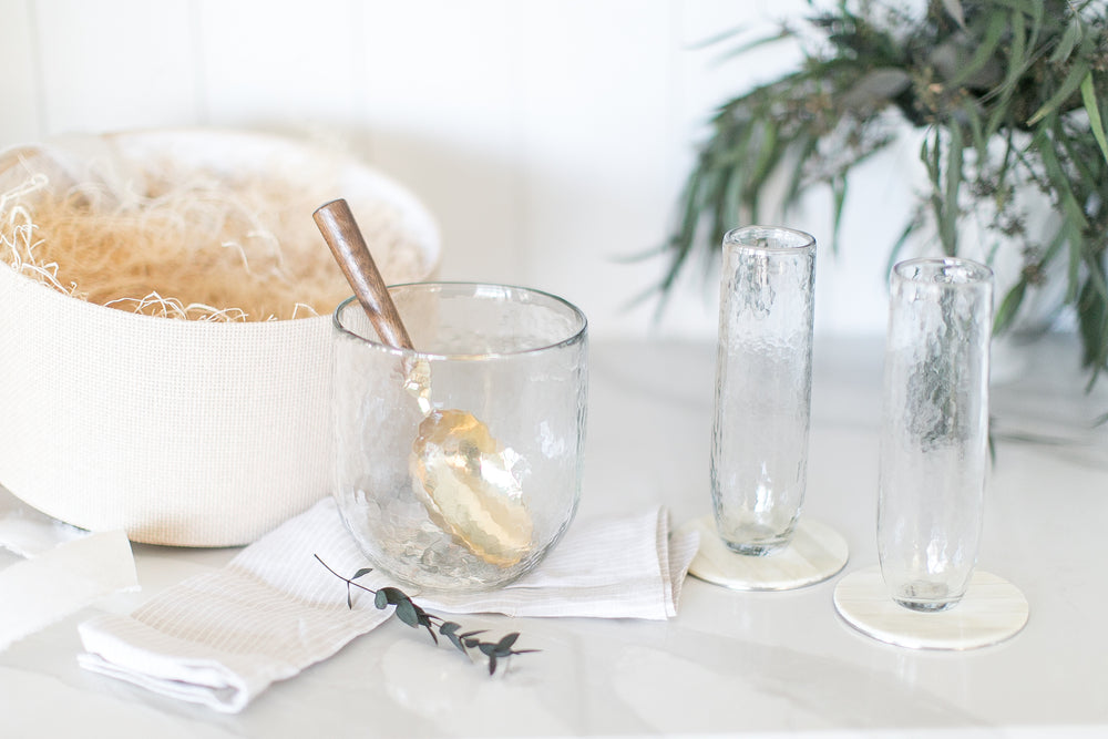 Beautiful gift box contains all you need for a celebration with stemless champaign flutes, chilling bucket, ice scoop, and coasters!