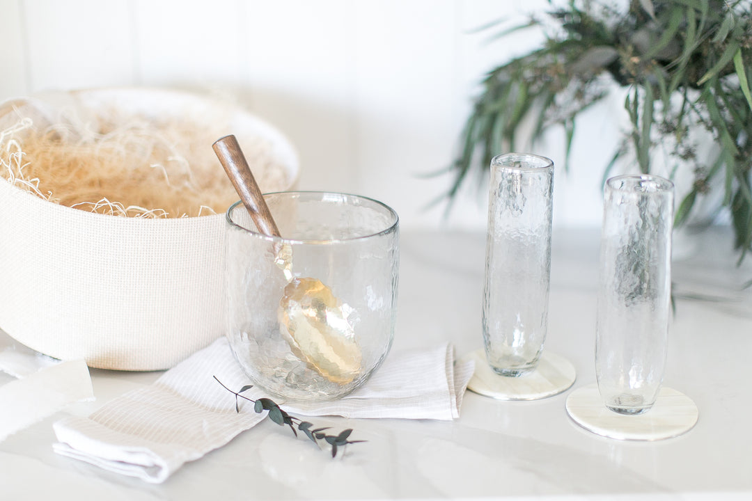 Beautiful gift box contains all you need for a celebration with stemless champaign flutes, chilling bucket, ice scoop, and coasters!