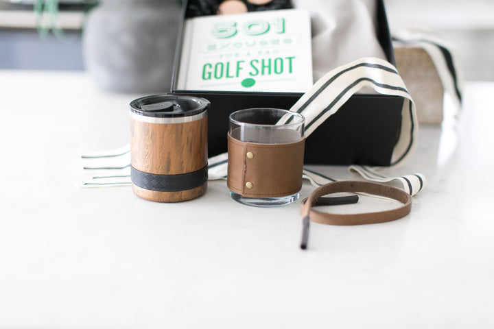 Birdie Gift Box from Mercy Forest Co. offers a golf themed gift box that can be customized with either an insulated tumbler, leather wrapped whisky glass or leather sunglass strap. 