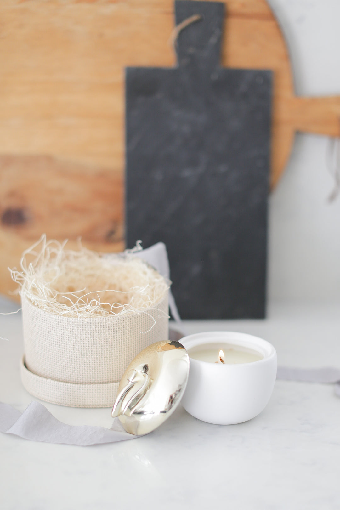 White ceramic vessel with brass top - apple candle. Comes in a woven paper gift box. Ready to ship or local pick up