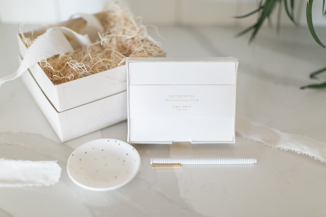 Sweet, simple and intentional gifting from Mercy Forest Co. with the Nancy gift box. Includes Sugar Paper Desk Jotter notepad in a linen holder, striped felt tip pen and ceramic trinket tray. 