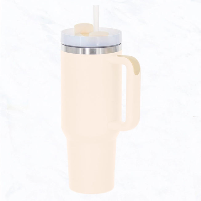 A cream 40oz tumbler with straw and handle on a white background.