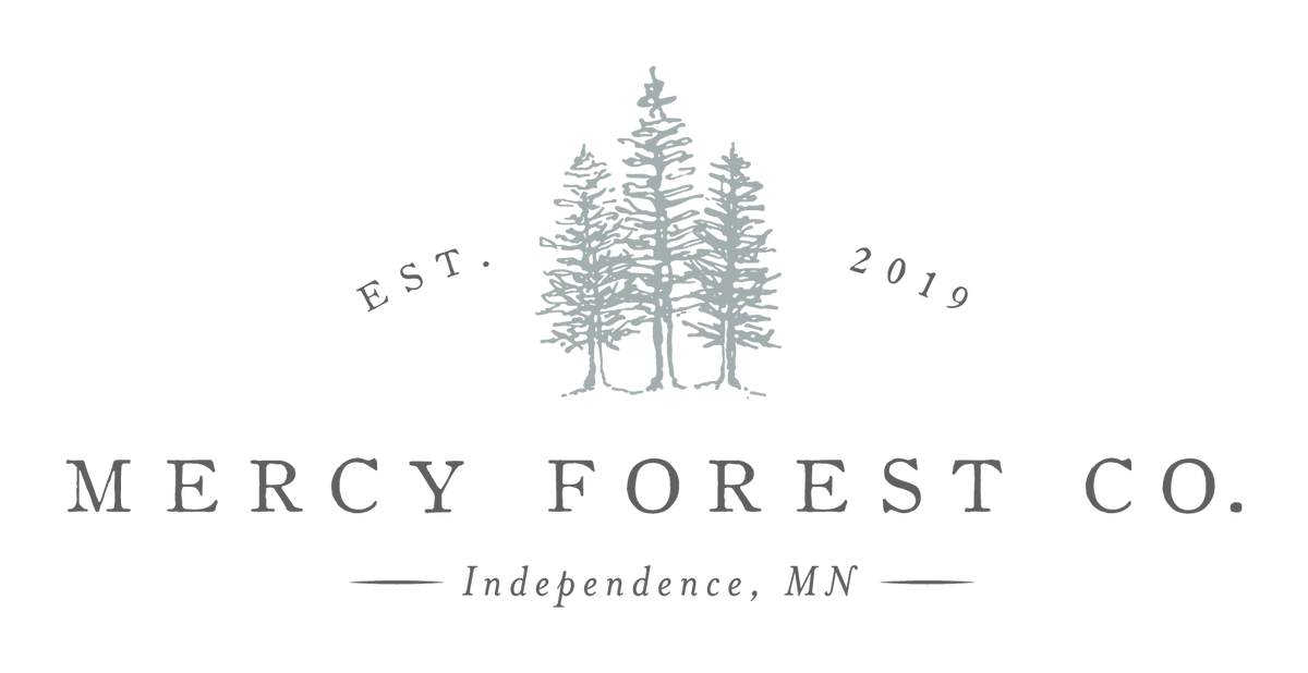 Mercy Forest Co. logo — three pines, Independence, MN, est. 2019