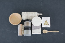 Load image into Gallery viewer, spa gift box, Comfort gift for those in need of self care, includes Nash and Jones clay mask, sea sponge and shower steamers. Gift is ready to ship in black woven basket with lid and ribbon. Mercy Forest Co. gifting. Custom curated gifts that are ready to ship and be delivered. 