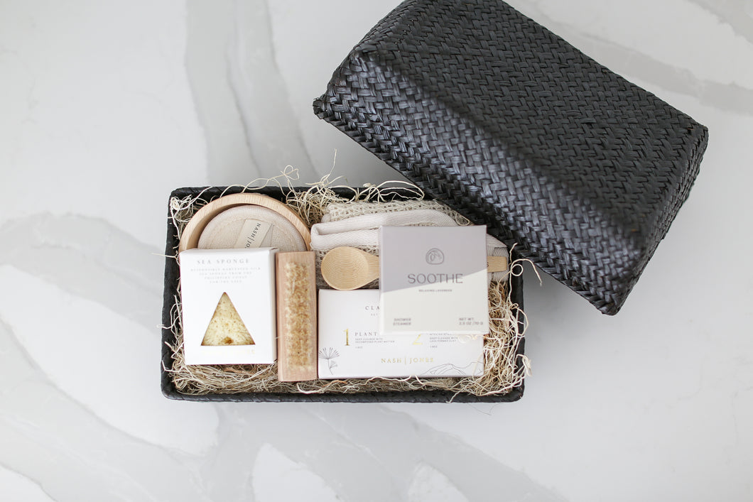 Comfort gift for those in need of self care, includes Nash and Jones clay mask, sea sponge and shower steamers. Gift is ready to ship in black woven basket with lid and ribbon. Mercy Forest Co. gifting. Custom curated gifts that are ready to ship and be delivered, spa gift box