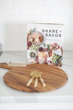 Load image into Gallery viewer, Wood charcuterie board with personalization available, Appetizer and charcuterie cookbook, idea book for charcuterie board, brass and rattan wrapped cheese utensils, white countertop, Mercy Forest Co., custom gifting for realtors, on-demand ready-to-ship gifts, packaged gift box, share and savor cookbook