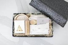 Load image into Gallery viewer, Comfort gift for those in need of self care, includes Nash and Jones clay mask, sea sponge and shower steamers. Gift is ready to ship in black woven basket with lid and ribbon. Mercy Forest Co. gifting. Custom curated gifts that are ready to ship and be delivered, spa inspired gift box with shower steamer options of either lavender or eucalyptus 