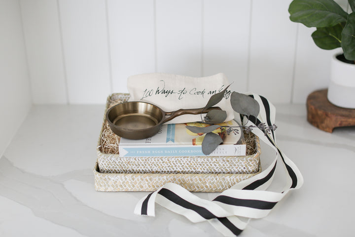 Gift box for family and friends, Gift box for clients, Real estate Closing Gift ideas, New home gift, welcome home gift, nest cookware cast iron pan, brass grinder, simple and meaningful gifts, gifts for people who like to cook, beautiful woven basket with lid, sustainable gifting, shiplap kitchen