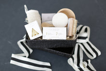 Load image into Gallery viewer, Comfort gift for those in need of self care, includes Nash and Jones clay mask, sea sponge and shower steamers. Gift is ready to ship in black woven basket with lid and ribbon. Mercy Forest Co. gifting. Custom curated gifts that are ready to ship and be delivered. 