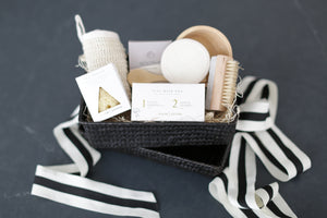 Comfort gift for those in need of self care, includes Nash and Jones clay mask, sea sponge and shower steamers. Gift is ready to ship in black woven basket with lid and ribbon. Mercy Forest Co. gifting. Custom curated gifts that are ready to ship and be delivered. 