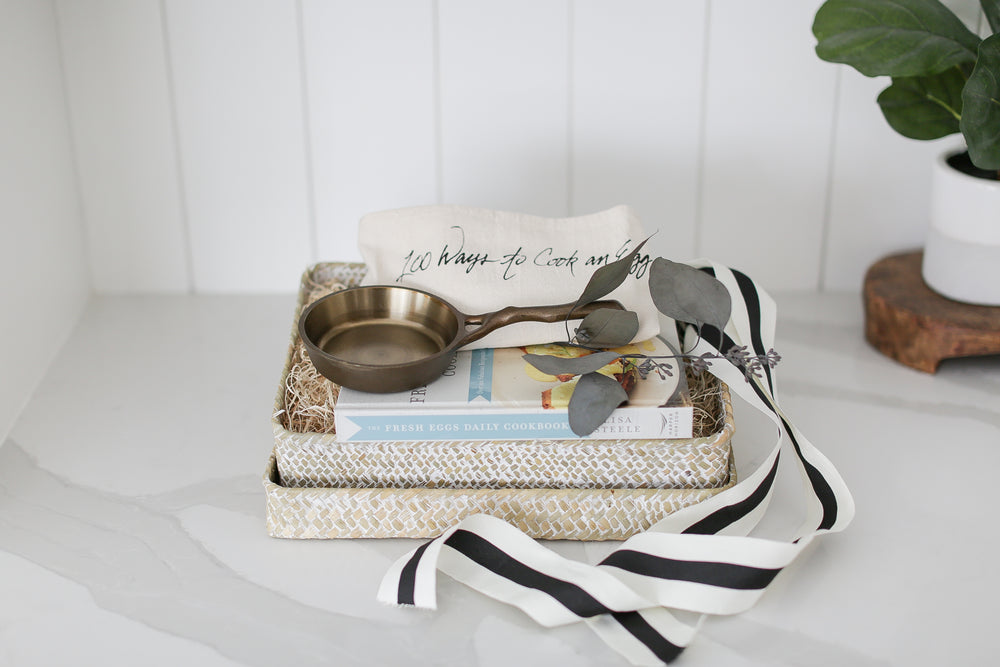 Gift box for family and friends, Gift box for clients, Real estate Closing Gift ideas, New home gift, welcome home gift, nest cookware cast iron pan, brass grinder, simple and meaningful gifts, gifts for people who like to cook, beautiful woven basket with lid, sustainable gifting, shiplap kitchen