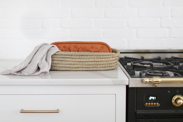 Impress your real estate clients with a thoughtful and delicious gift basket. Our gluten-free baguettes and elegant linen tea towel are the perfect way to show your appreciation. Mercy Forest Co. kitchen ready to ship gifts