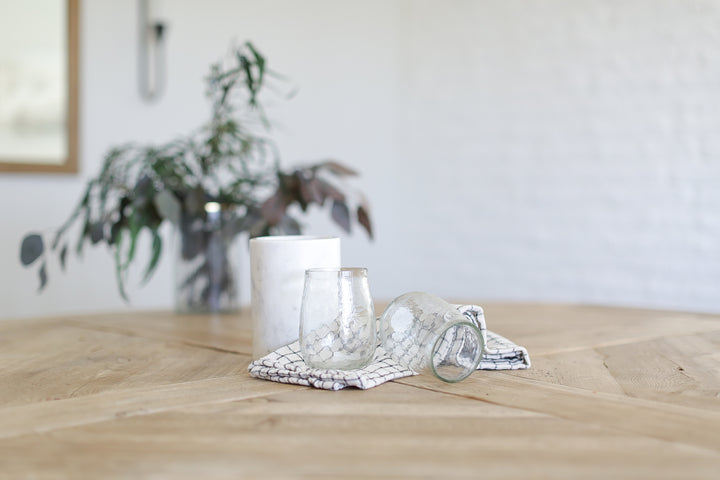 Custom curated gift boxes for new homeowners and home anniversaries with marble wine chiller, hammered stemless wine glasses, and cotton kitchen towel. Ready to ship and brand with your logo. Personalization of marble available. Mercy Forest Co.