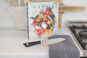 custom curated cooking gift box with custom knife, cookbook, and kitchen towel