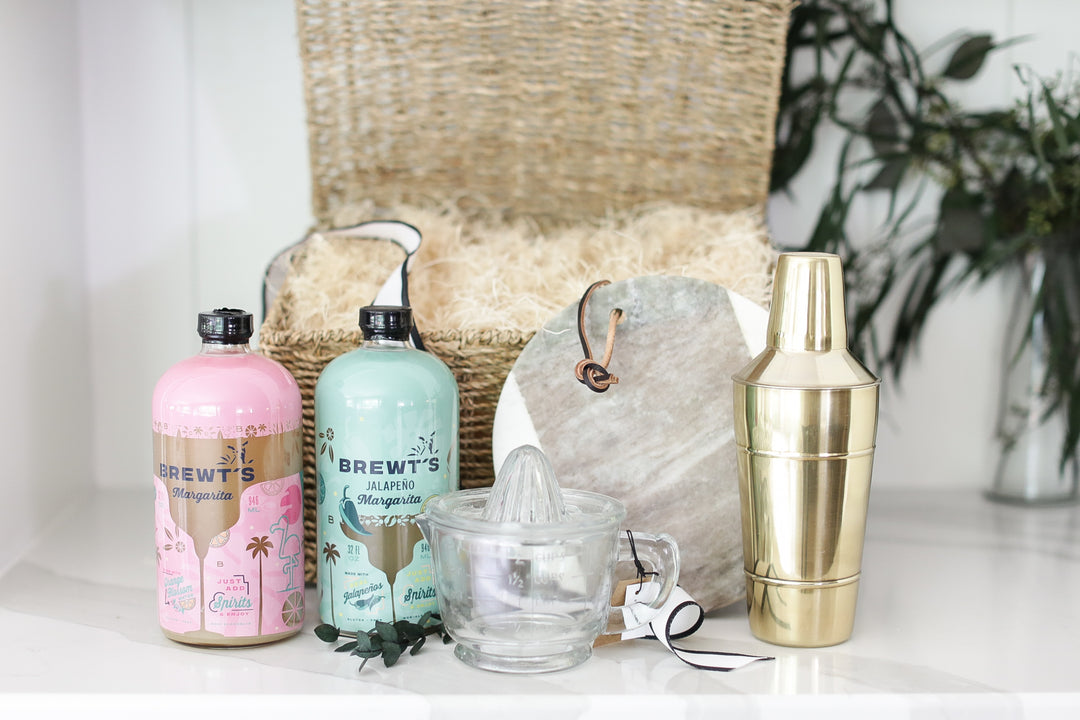 Realtor's secret weapon for unforgettable client gifts! This curated margarita basket delights new homeowners and celebrates anniversaries. Featuring premium Brewt's mix, a glass juicer, a brass shaker, and a marble board, it's the perfect touch to create lasting memories. Show you care and make a statement - order yours today, ready to ship tomorrow!