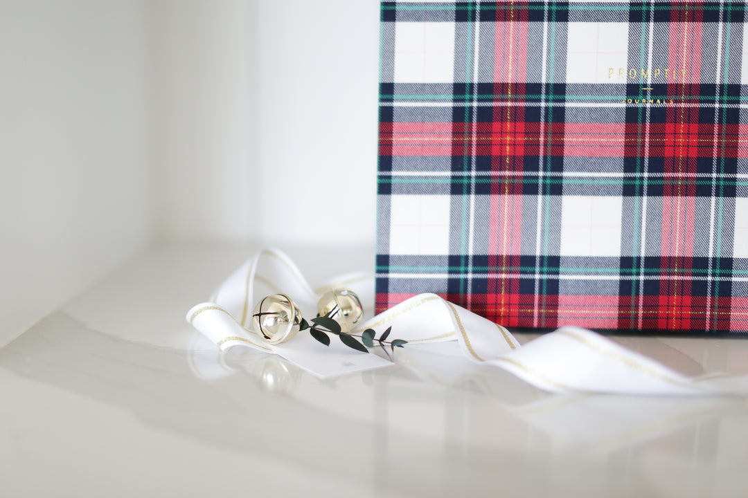 Custom curated holiday gift box with plaid promptly journal