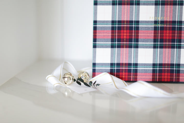 Custom curated holiday gift box with plaid promptly journal