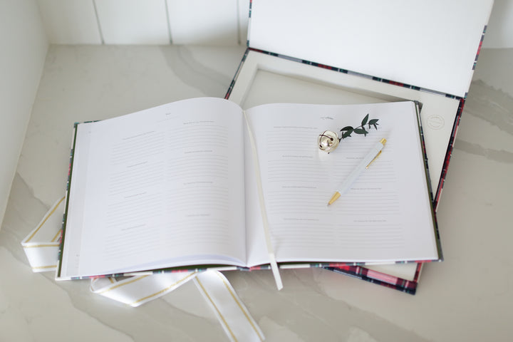 Custom curated holiday gift box with plaid promptly journal