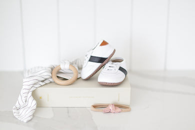 Adorable baby gift set featuring a keepsake journal, stylish leather shoes, soothing teether, and optional accessories. Perfect for showers, birthdays, or just-because!
