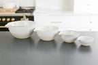 Unique cooking bowl gift items, Custom curated gift box with baking bowls and utensils,  stoneware stacking baking bowls, brass wire whisk, brass measuring spoons, striped apron, Mercy Forest Co., real estate gifting, client gifting ideas, 